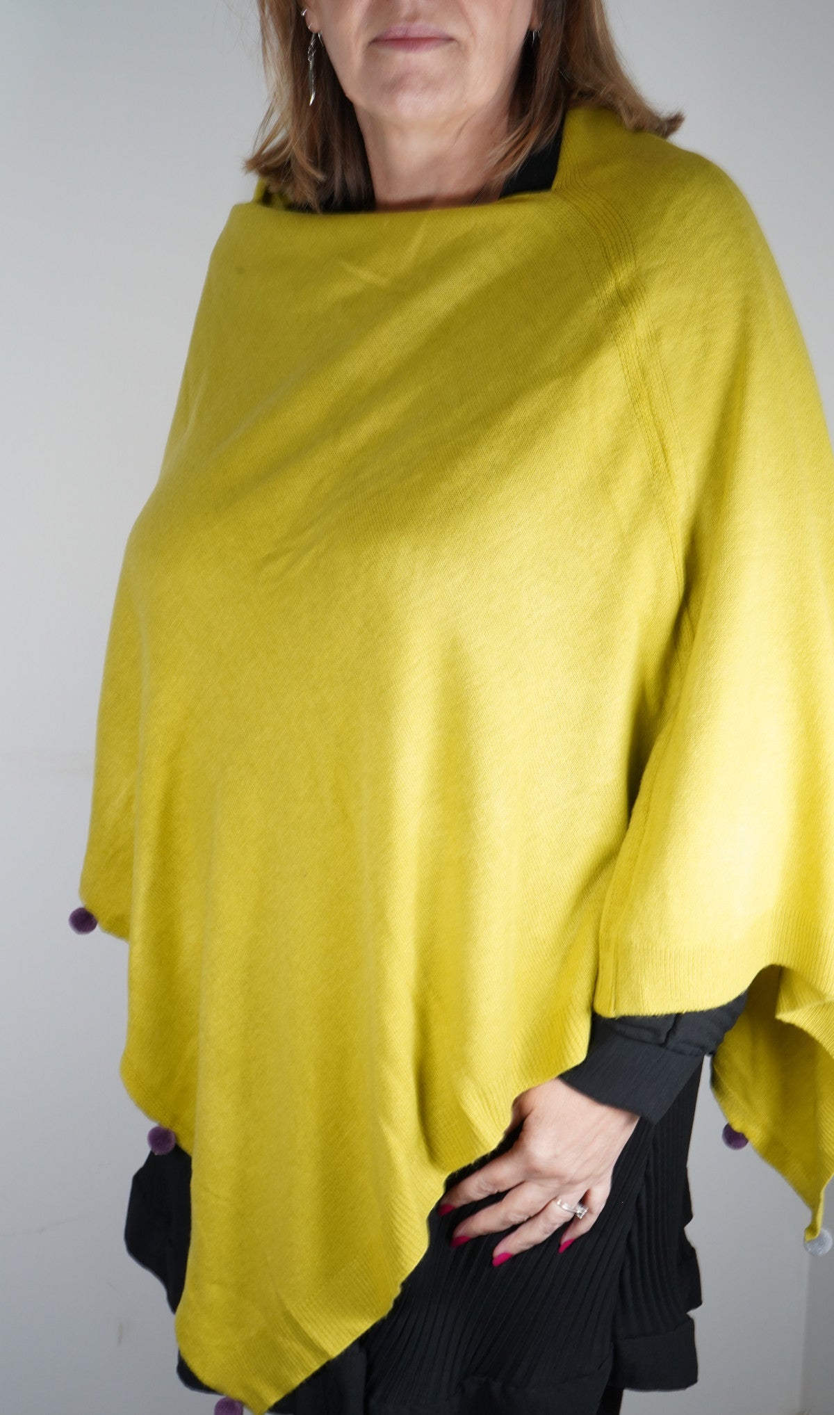 Pom pom edge poncho in lime green